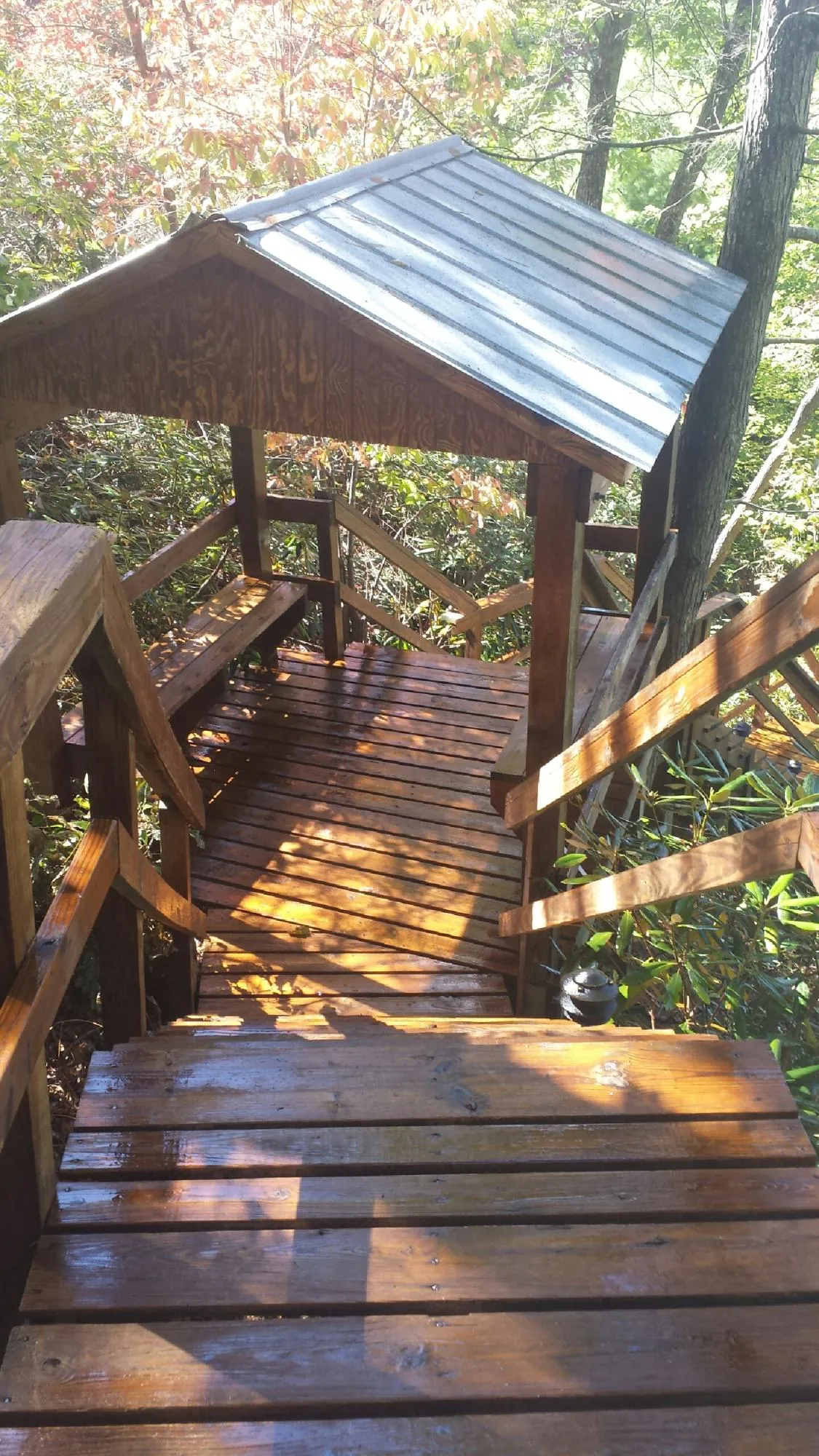 Freshly stained wood walkway and covered shelter with a metal roof in Johnsonville